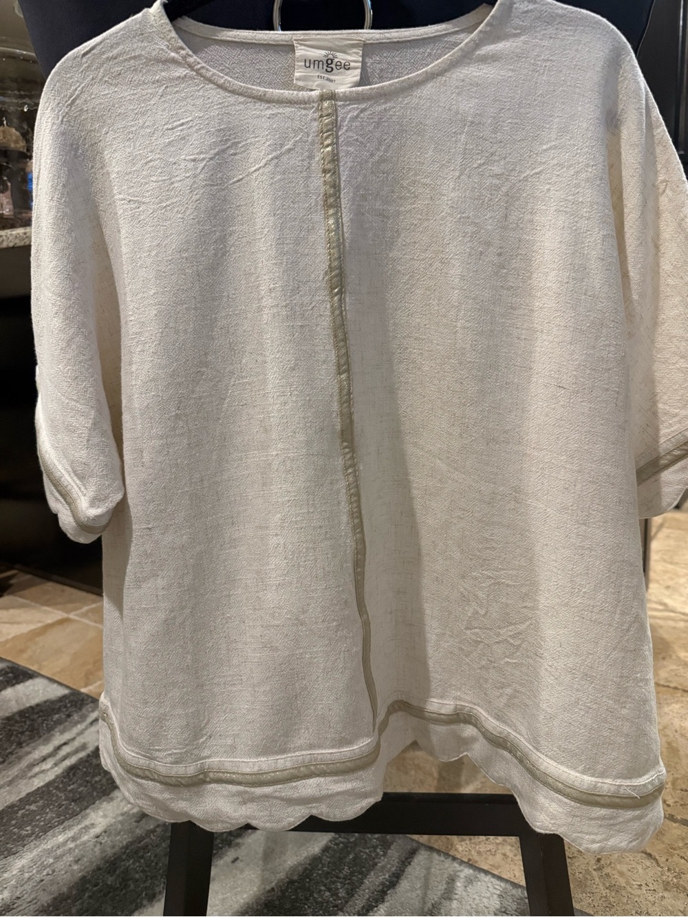 Umgee Cream Linen-Blend Short Sleeve Tunic with Scalloped Hem with gold accents.